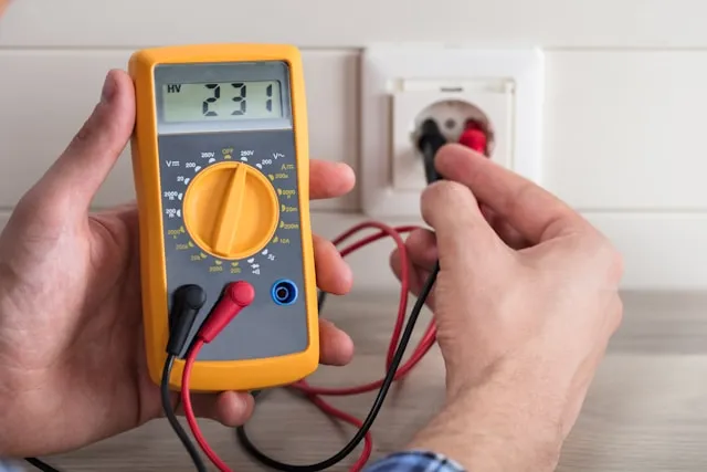Montreal electrician conducting electrical safety inspection in older home