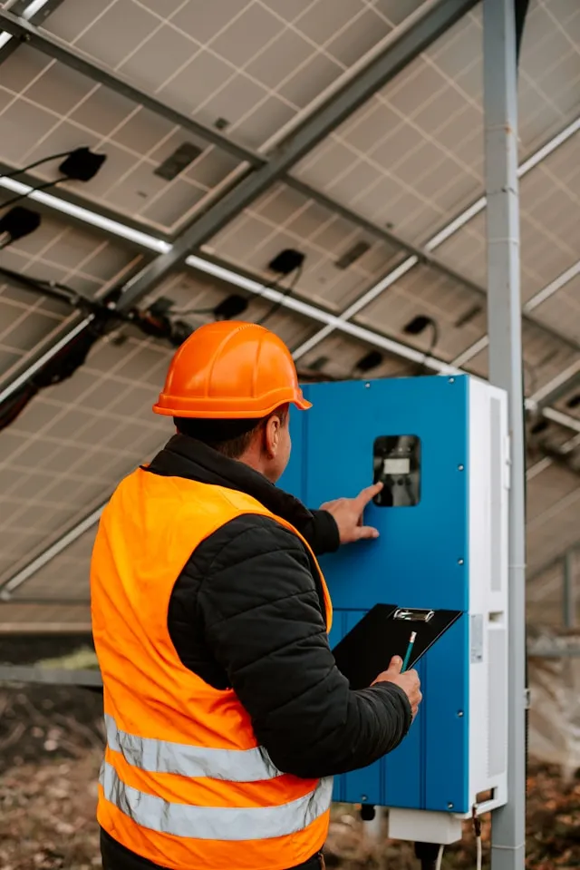 Master electrician performing industrial electrical inspection in Montreal